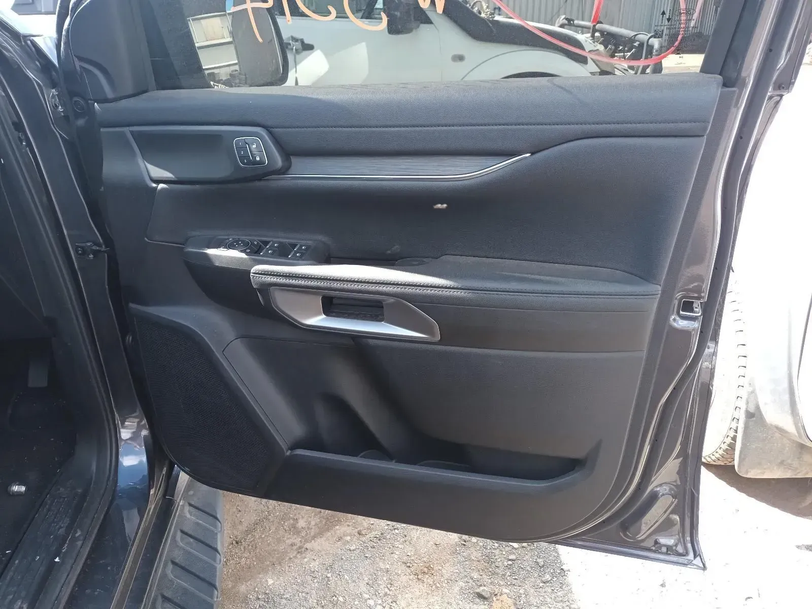 Black Car Door Interior With Controls, Handle, and Storage Pocket — South West 4WD Wreckers In Brisbane, QLD