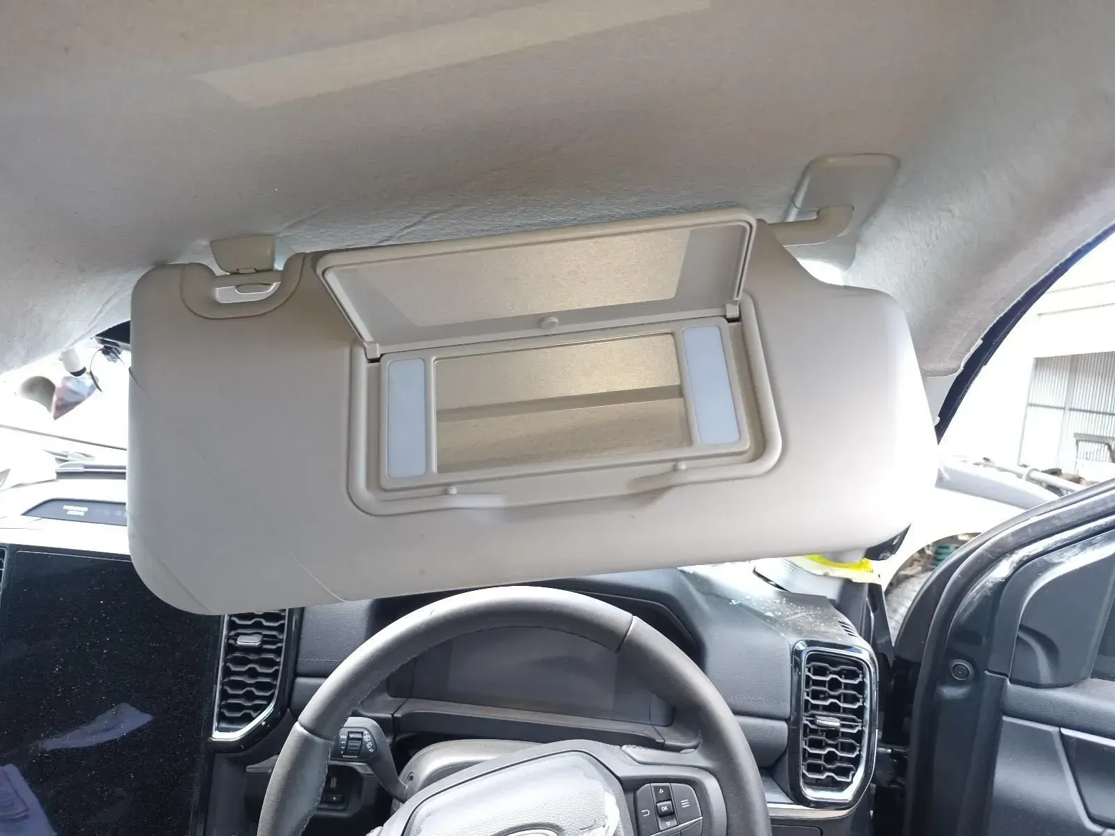 Beige Sun Visor in Car, With Mirror Open, Above Steering Wheel — South West 4WD Wreckers In Brisbane, QLD