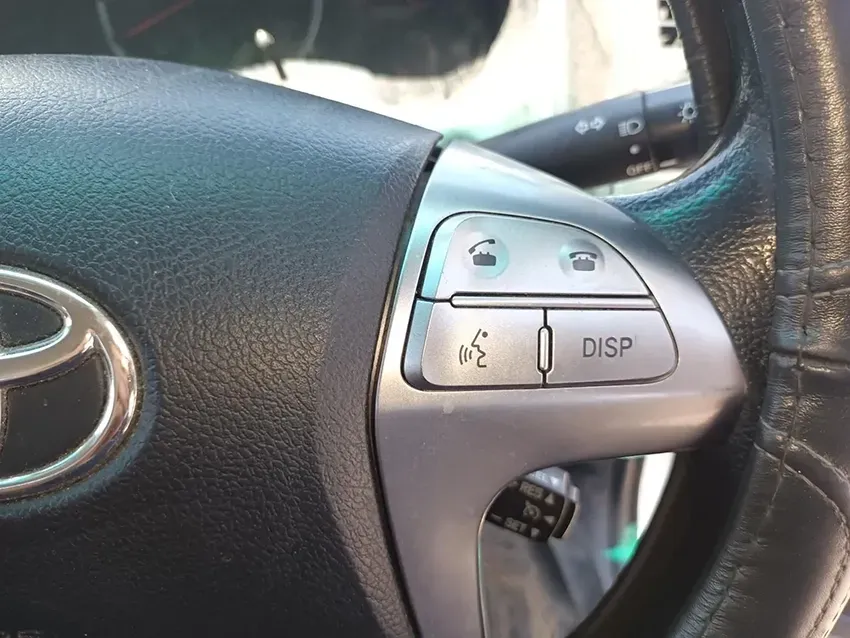 A Close Up of a Toyota Steering Wheel With a Disp Button — South West 4WD Wreckers In Brisbane, QLD