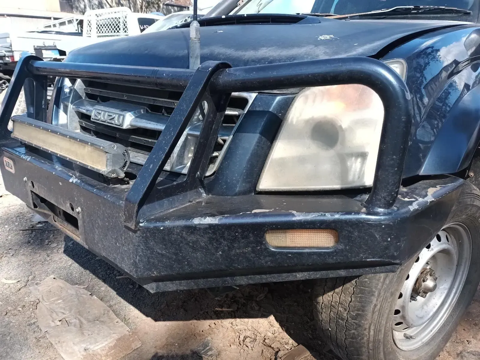 Dark Blue Isuzu Truck With a Bull Bar and a Light Bar — South West 4WD Wreckers In Brisbane, QLD