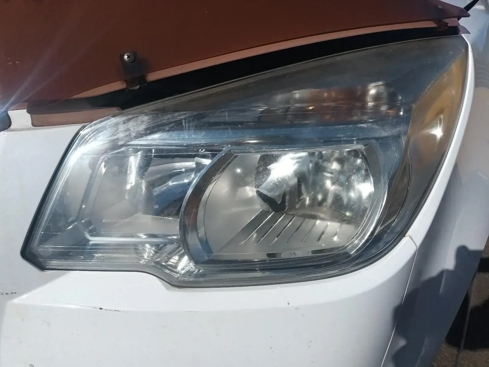 White Car Headlight Close-up — South West 4WD Wreckers In Brisbane, QLD