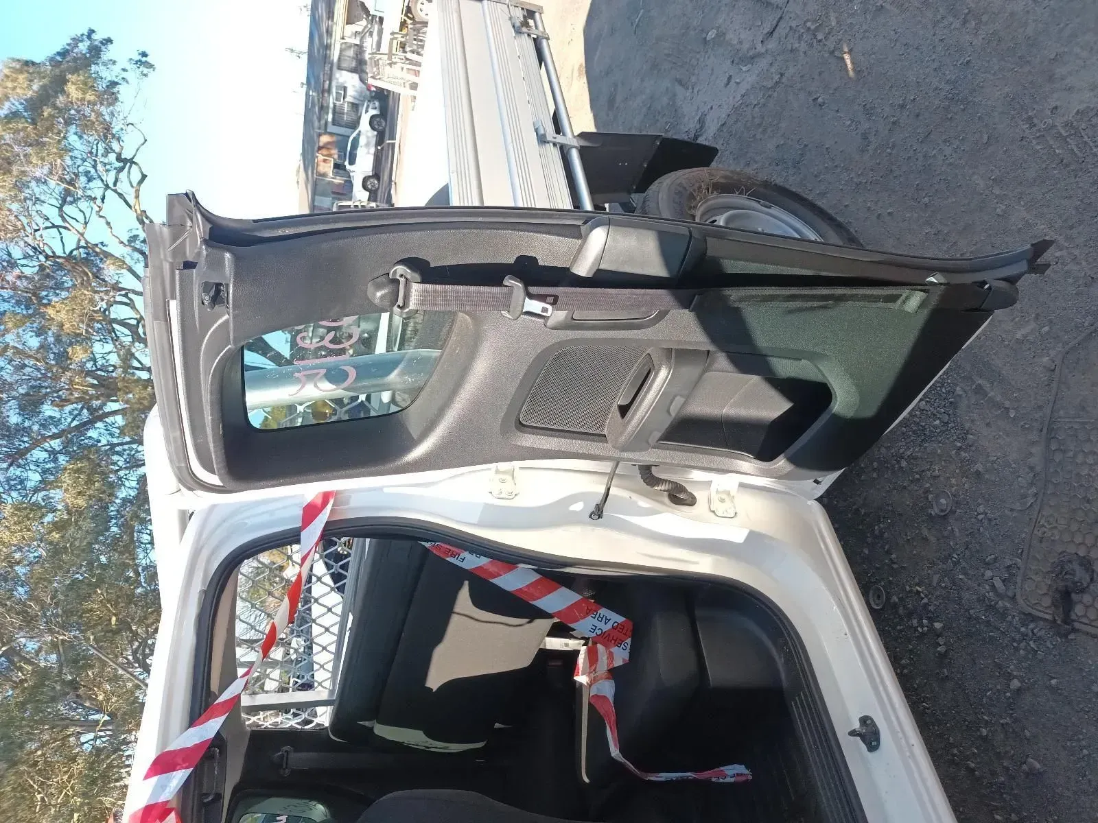 Open Hatchback of a White Car With Hazard Tape — South West 4WD Wreckers In Brisbane, QLD