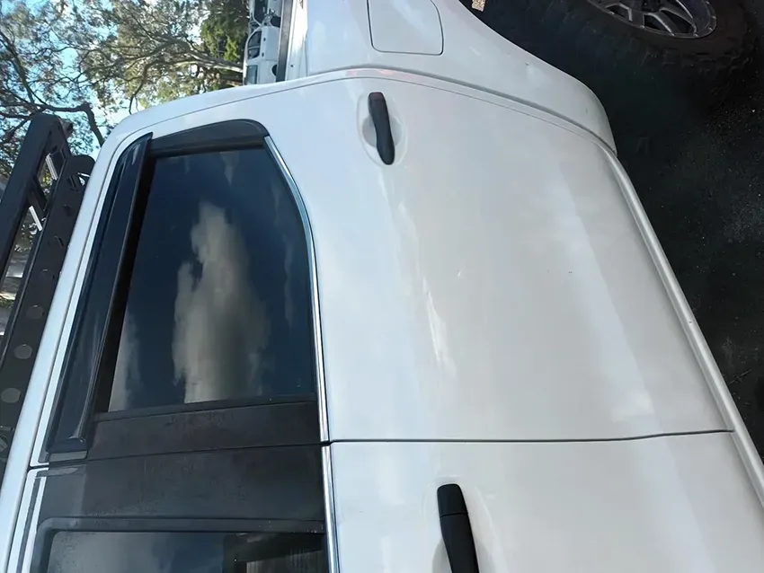 A White Truck is Parked on the Side of the Road — South West 4WD Wreckers In Brisbane, QLD