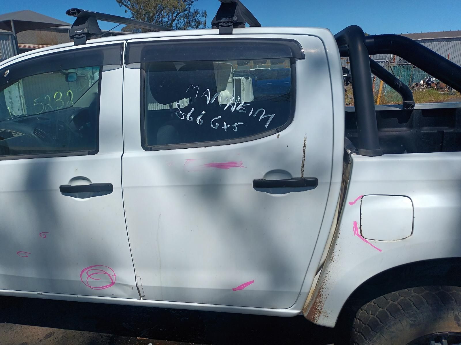 A White Truck With a Roof Rack is Sitting on the Ground — South West 4WD Wreckers In Brisbane, QLD