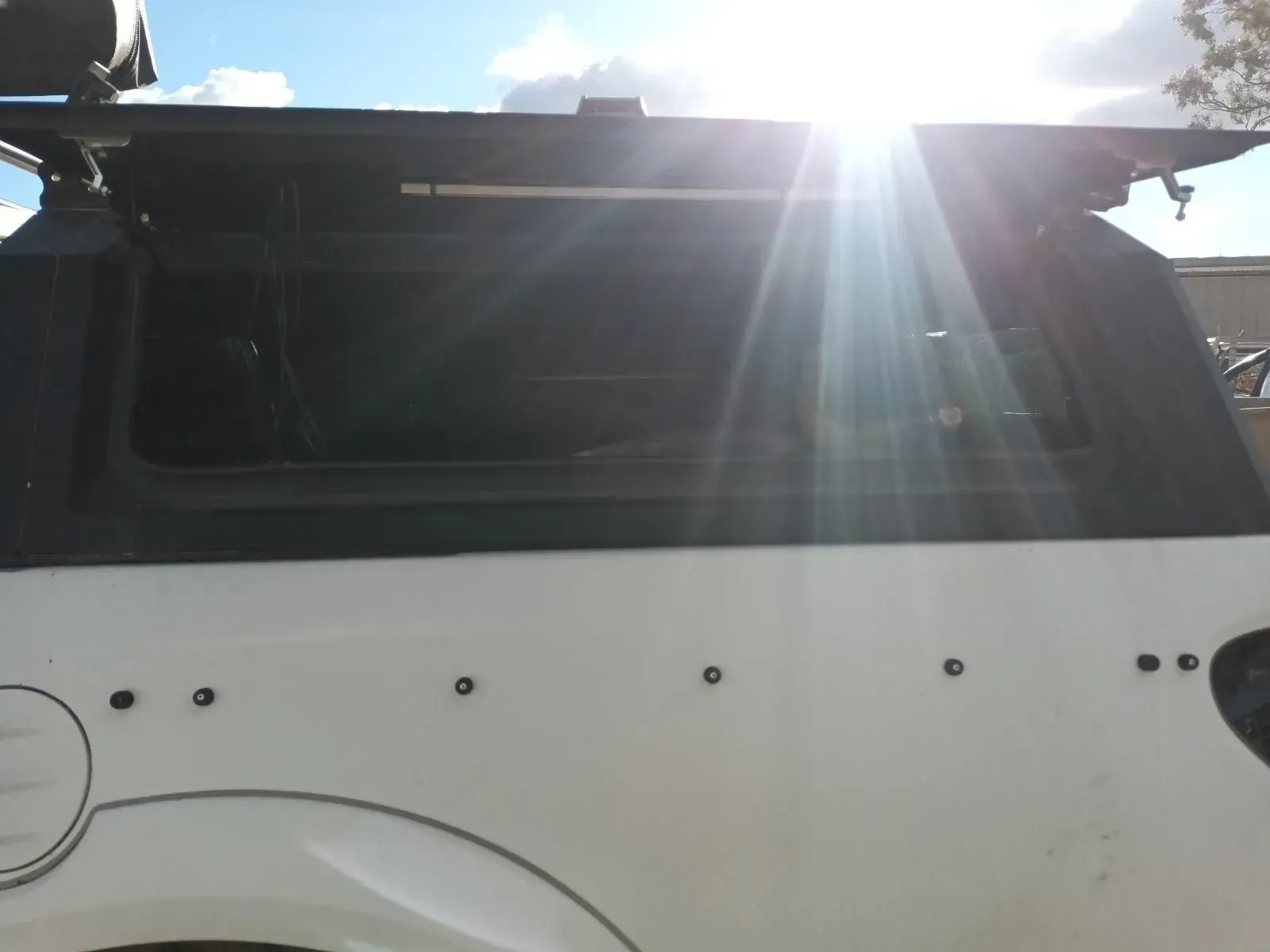 White Car Side With Black Topper, Sunny Outdoors — South West 4WD Wreckers In Brisbane, QLD