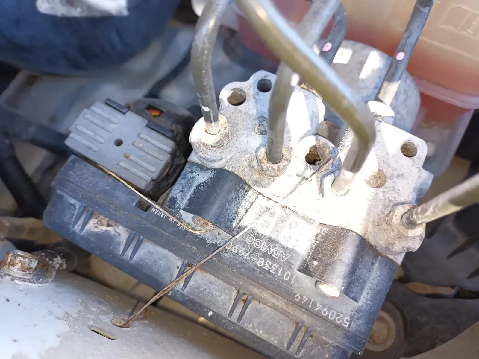 Close-up of an Abs (Anti-lock Braking System) Module in a Car Engine Compartment — South West 4WD Wreckers In Brisbane, QLD