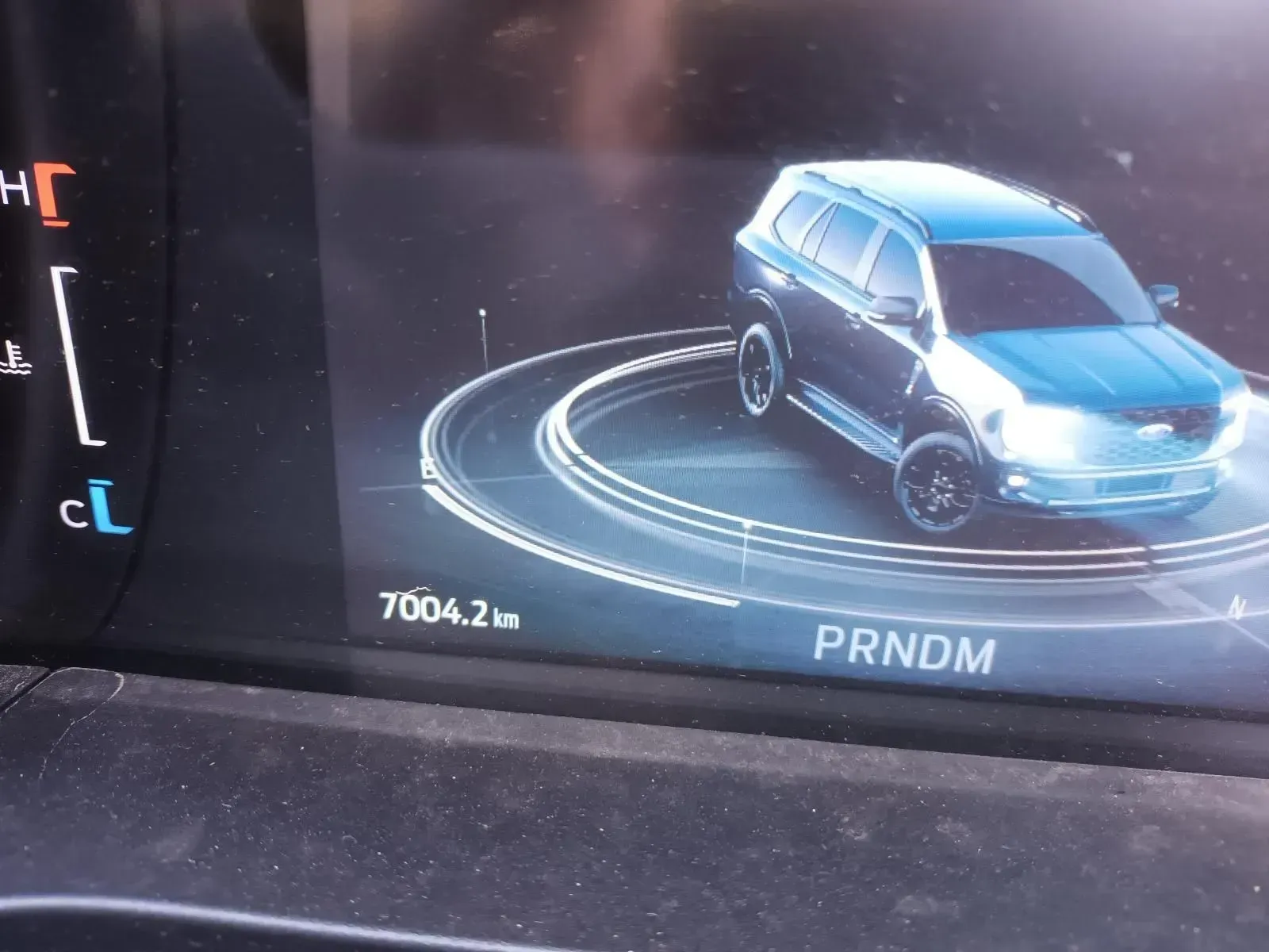 Dashboard Displaying a Car Icon, Gear Selector, and Mileage of 7004.2 Km — South West 4WD Wreckers In Brisbane, QLD