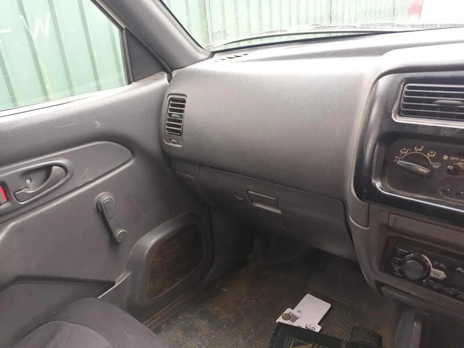 Interior of a Gray Mitsubishi Pickup Truck Showing Dashboard, Vents, and Controls — South West 4WD Wreckers In Brisbane, QLD