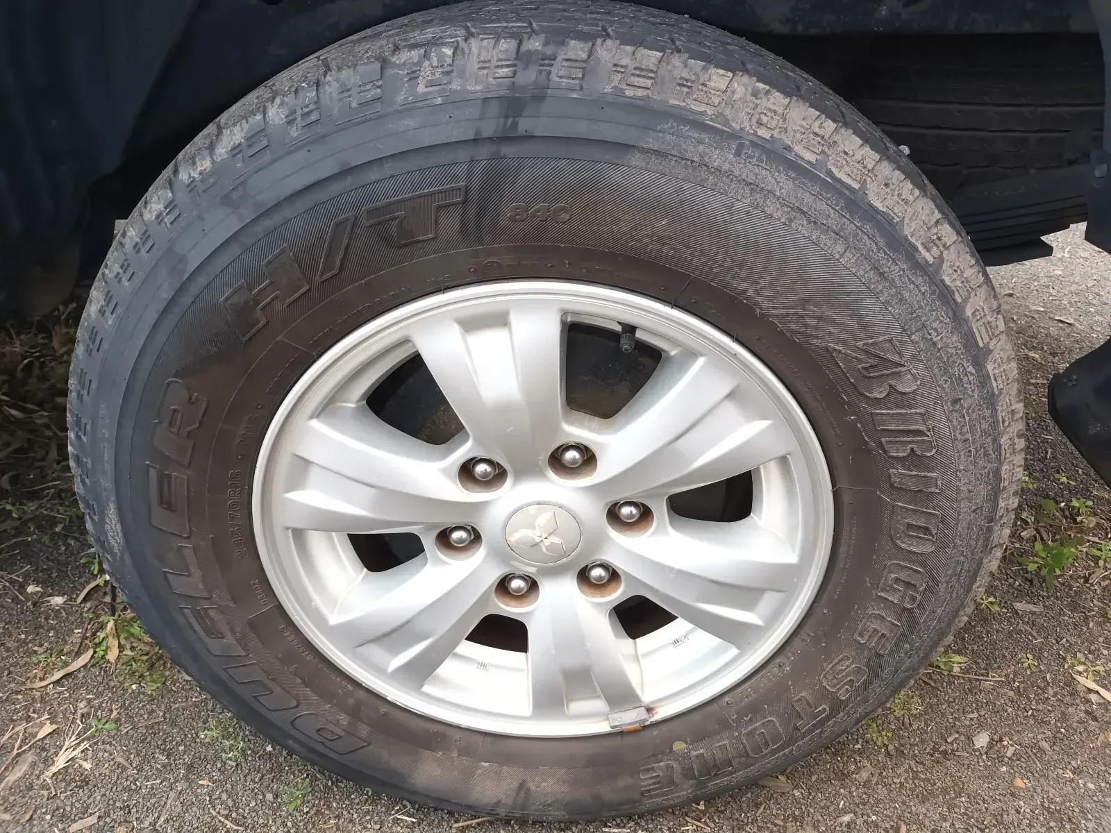 Silver Car Wheel With a Tyre on a Black Vehicle Parked Outdoors — South West 4WD Wreckers In Brisbane, QLD