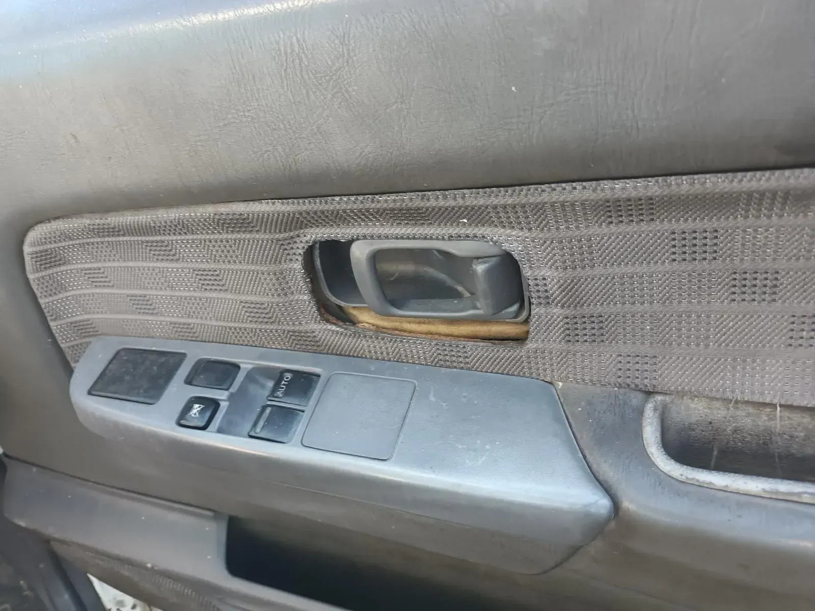 Gray Car Door Panel With Handle and Window Controls — South West 4WD Wreckers In Brisbane, QLD