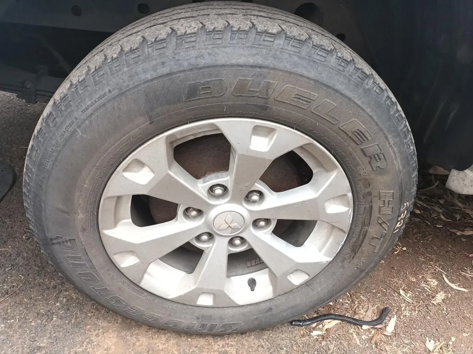 Close-up of a Car Tyre, Showing the Wheel and Worn Tyre Tread — South West 4WD Wreckers In Brisbane, QLD