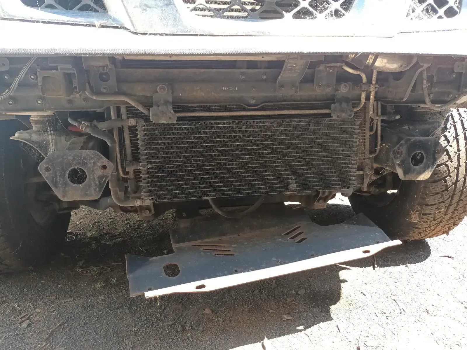 Front of a Vehicle With a Damaged Radiator and Missing Undercarriage Panel — South West 4WD Wreckers In Brisbane, QLD