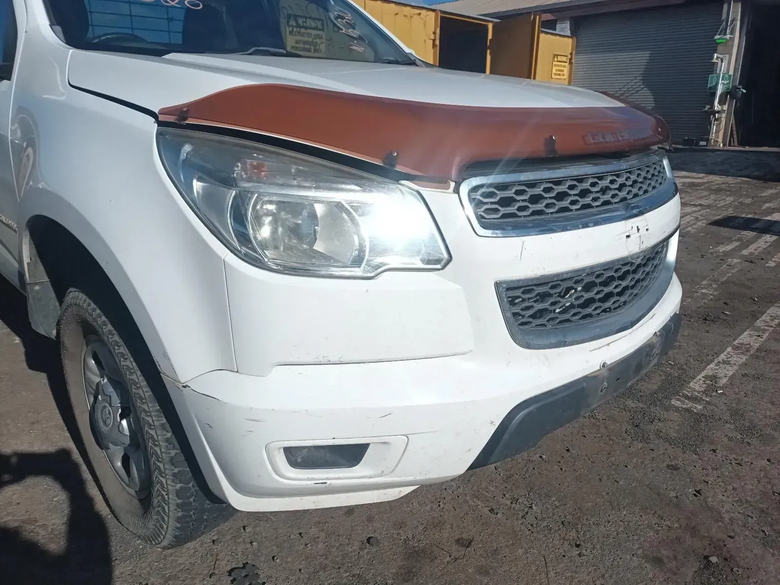 White Chevrolet Pickup Truck, Brown Hood Protector, Dented Front Bumper — South West 4WD Wreckers In Brisbane, QLD