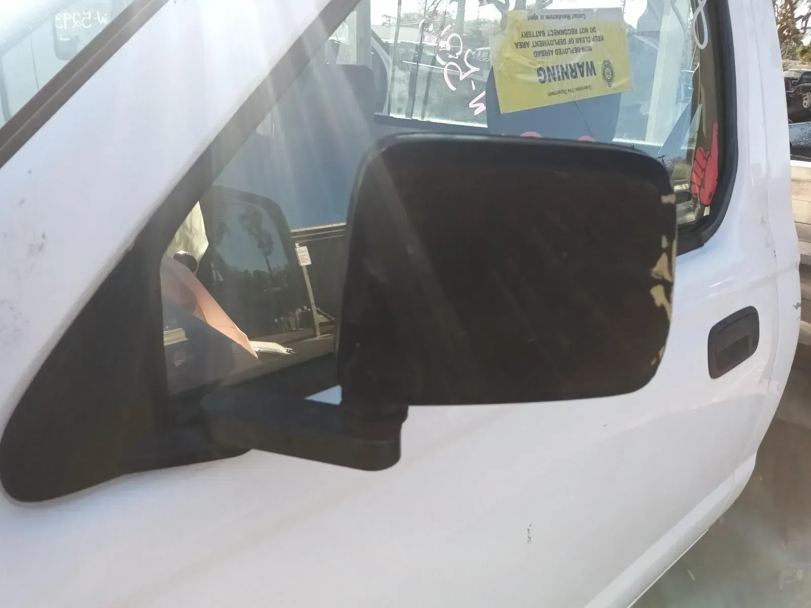 Black Side Mirror on a White Truck, With a Yellow Tag on the Window — South West 4WD Wreckers In Brisbane, QLD