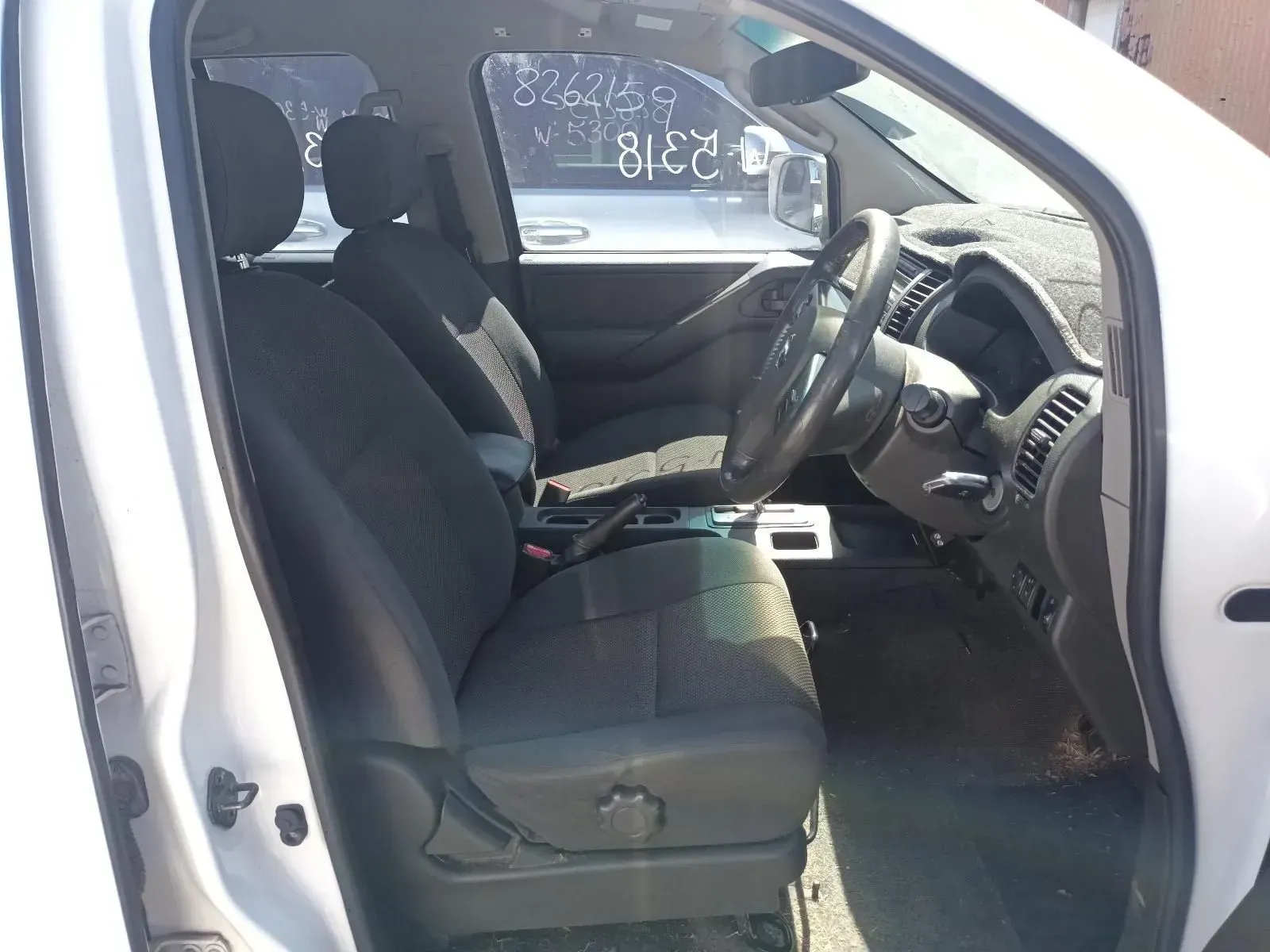 Interior of a White Car, Showing the Front Seats — South West 4WD Wreckers In Brisbane, QLD