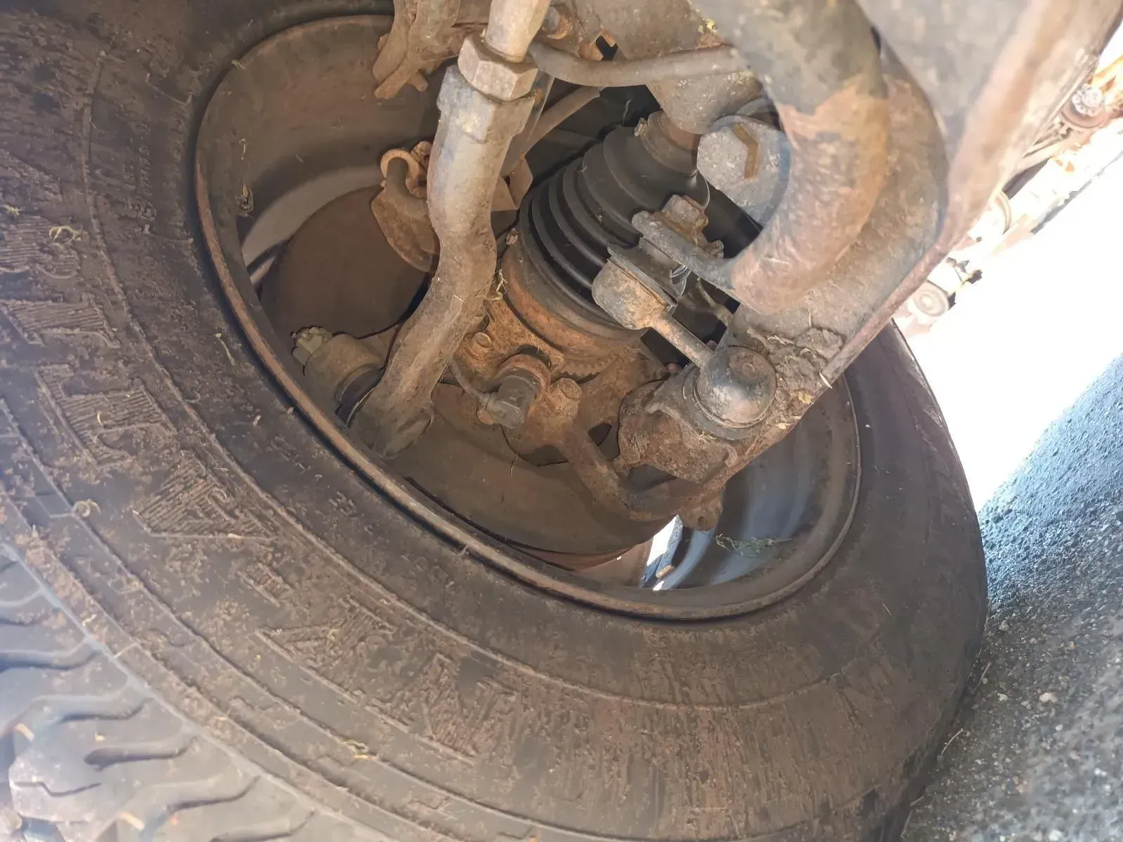 Close-up of a Vehicle's Front Wheel and Suspension System — South West 4WD Wreckers In Brisbane, QLD