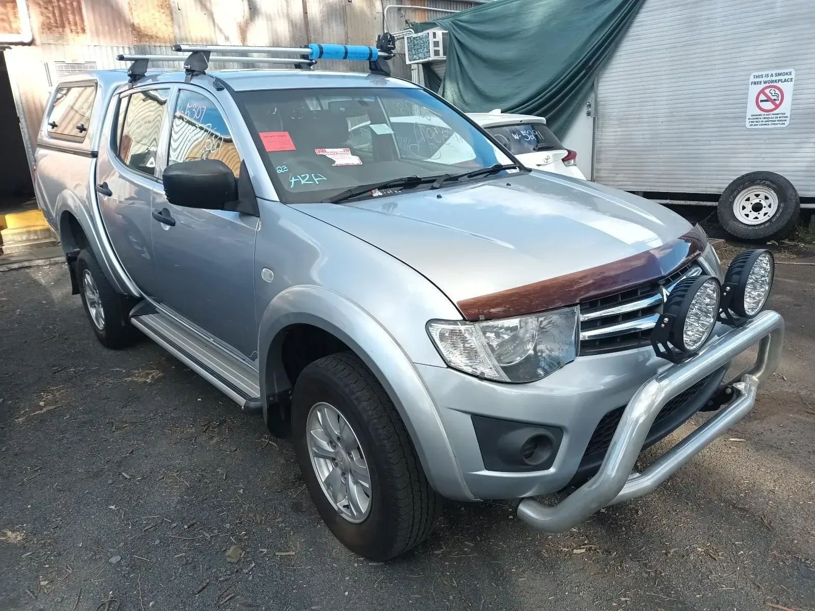 Silver Mitsubishi Triton Pickup Truck Parked — South West 4WD Wreckers In Brisbane, QLD