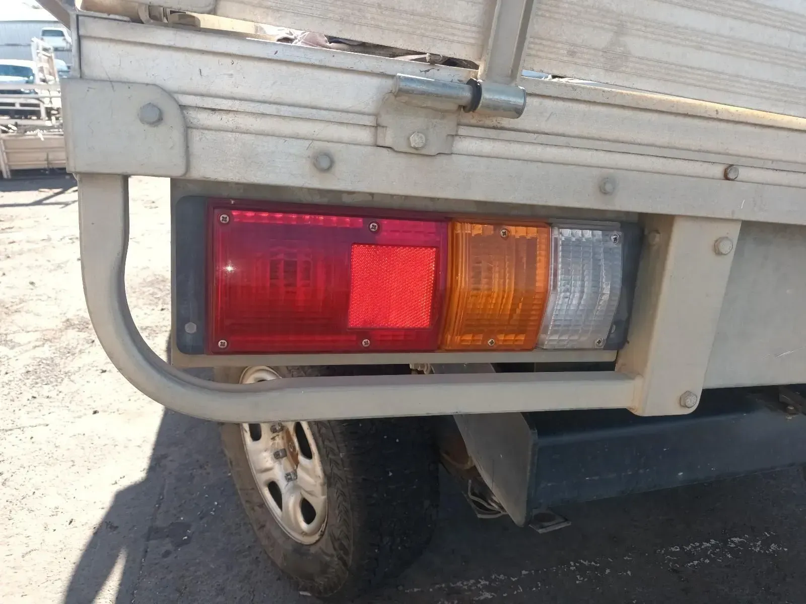 Taillight of a Beige Pickup Truck With Red, Amber, and Clear Lenses — South West 4WD Wreckers In Brisbane, QLD