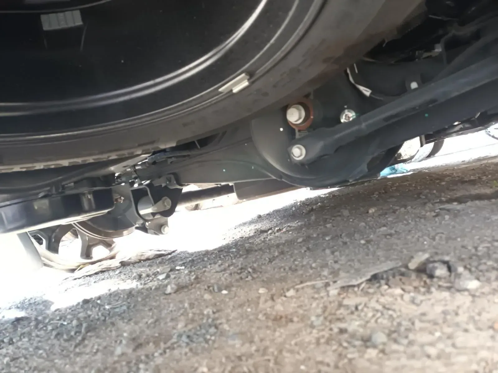 Undercarriage of a Vehicle, Showing Suspension Components, Bolts, and Spare Tyre — South West 4WD Wreckers In Brisbane, QLD