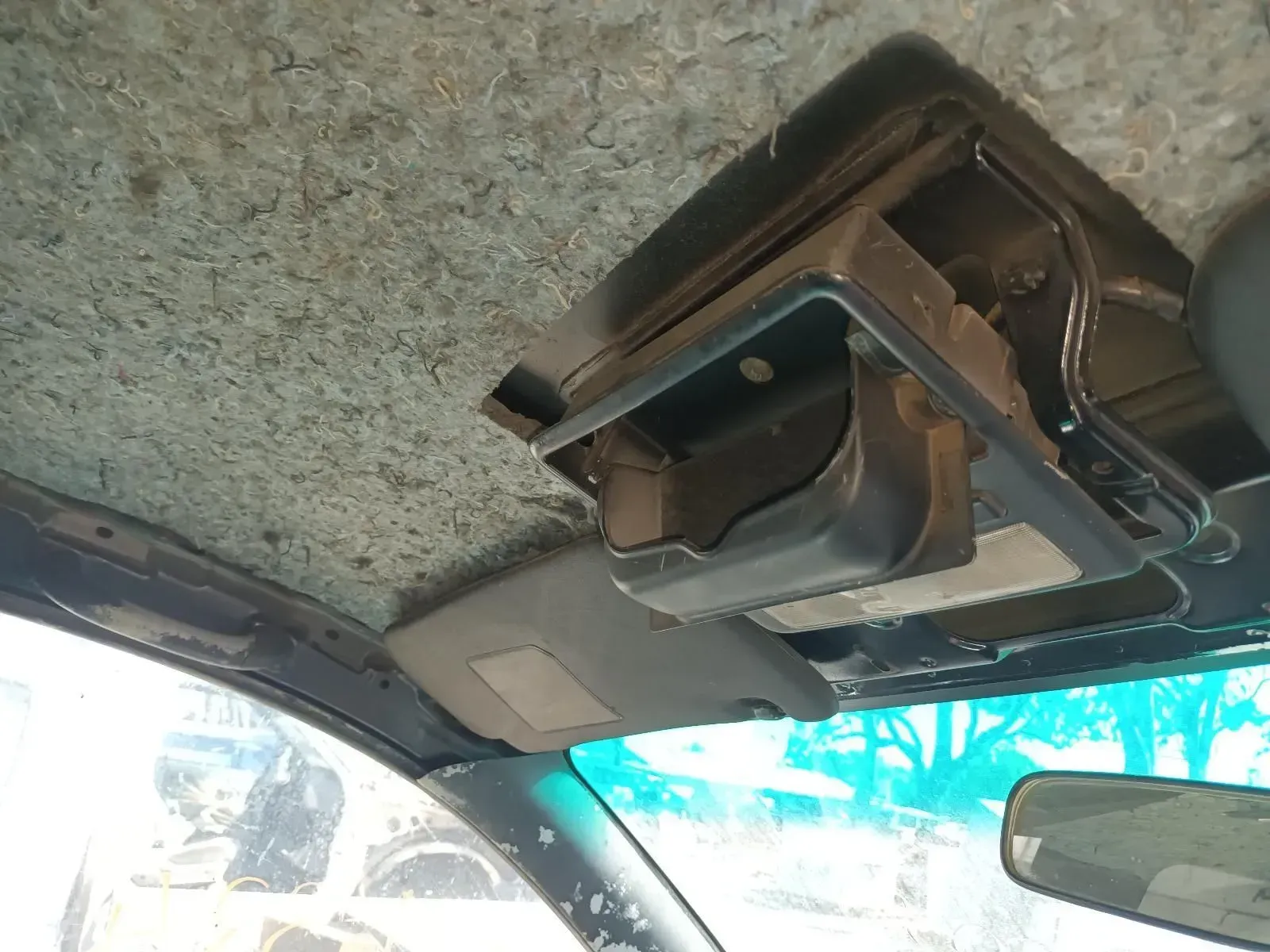 Interior Car View Showing Overhead Console, Visor, and Dirty Headliner — South West 4WD Wreckers In Brisbane, QLD