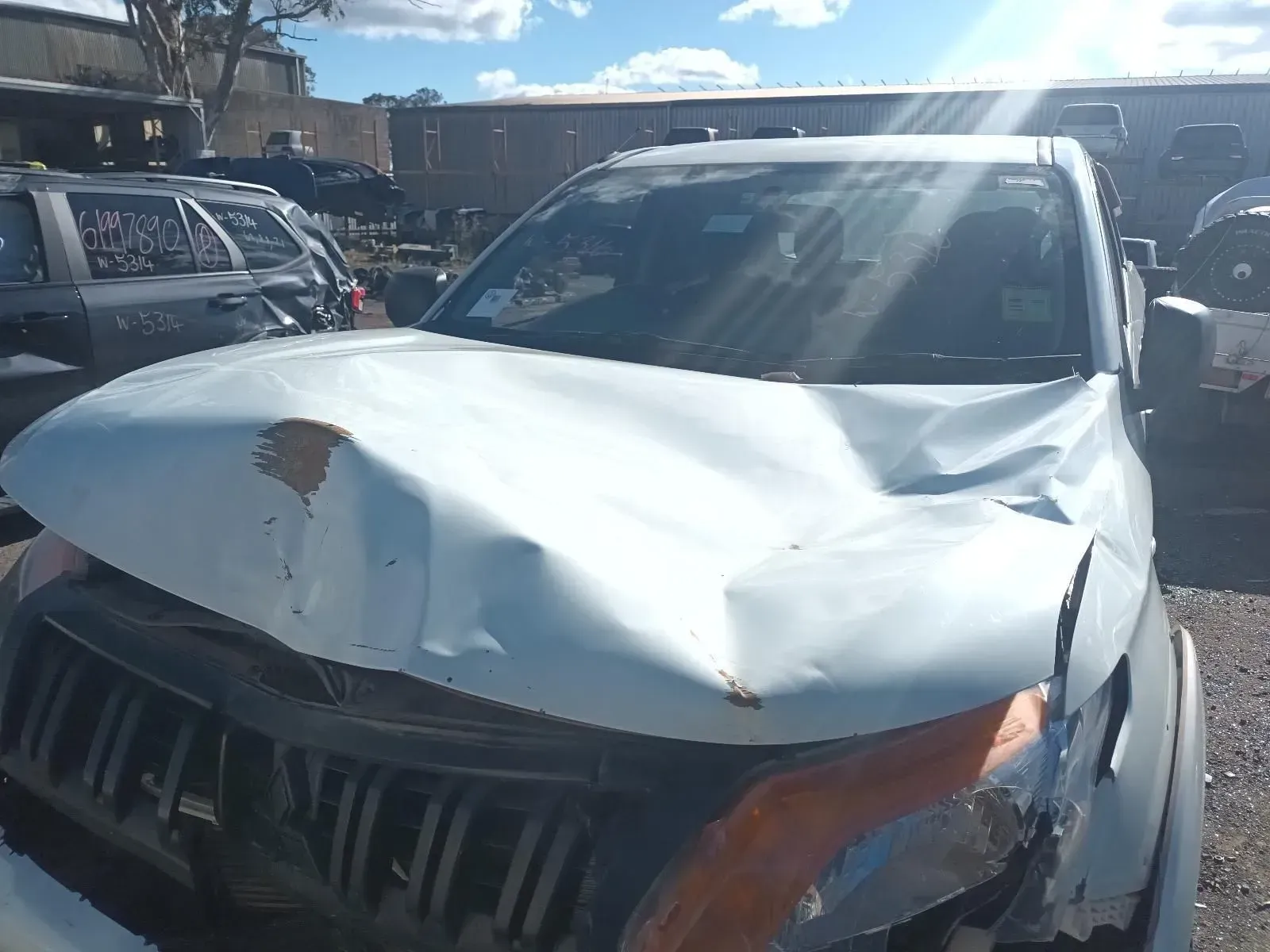 White Pickup Truck With Significant Front-end Damage — South West 4WD Wreckers In Brisbane, QLD