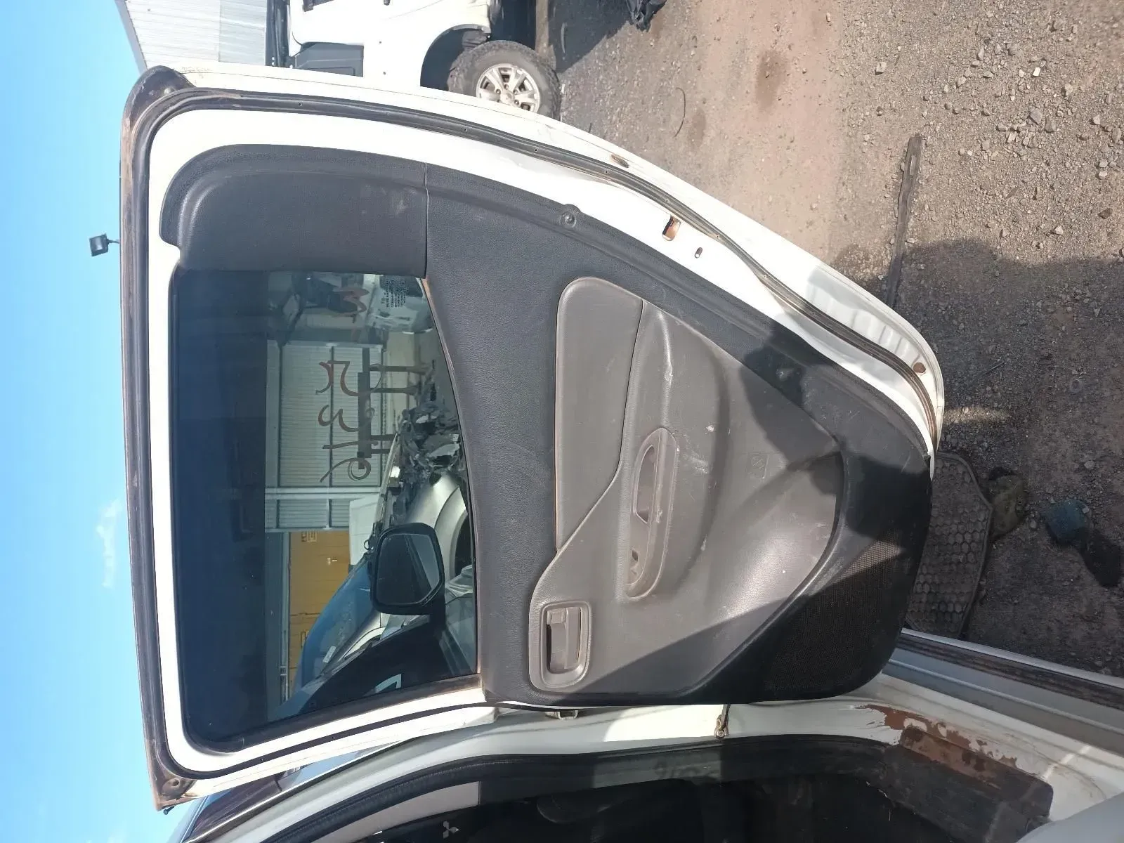 White Car Door Open, Showing Interior Panel, Handle, and Window — South West 4WD Wreckers In Brisbane, QLD