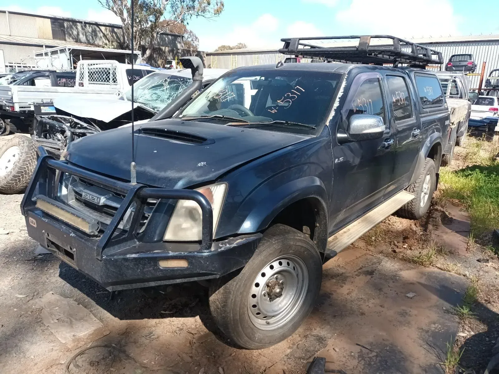 Dark Blue Isuzu Pickup Truck With Bull Bar — South West 4WD Wreckers In Brisbane, QLD