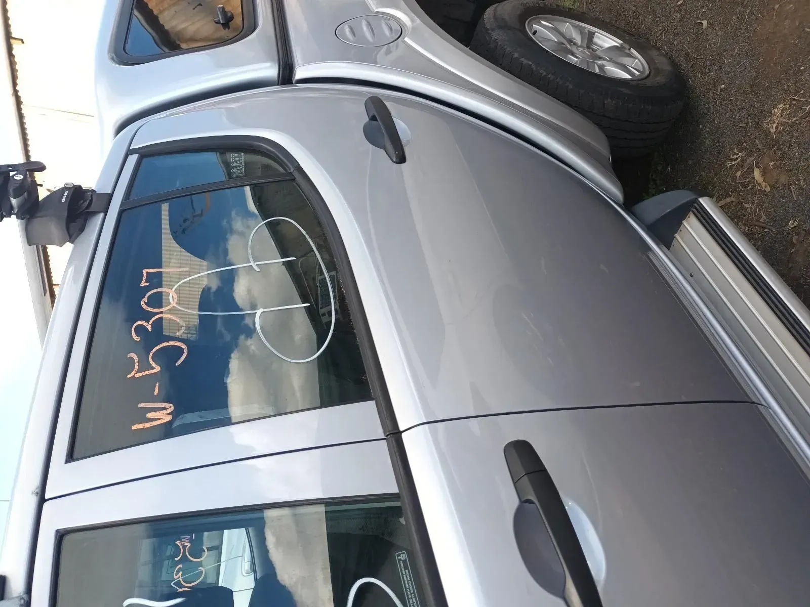 Silver Pickup Truck, Side View, in a Yard, Marked Windows — South West 4WD Wreckers In Brisbane, QLD