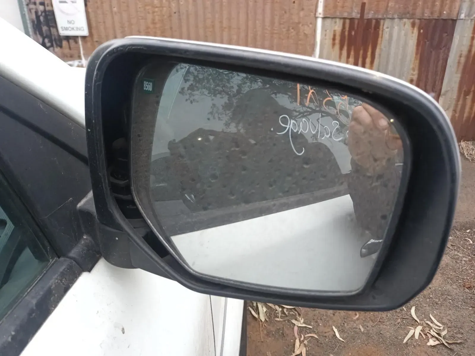 Side View Mirror of a White Car, Showing the Reflection of Outdoor Scenery — South West 4WD Wreckers In Brisbane, QLD