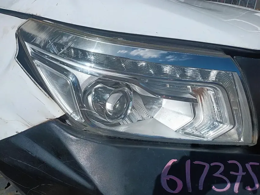 A Close Up of a Headlight on a White Car — South West 4WD Wreckers In Brisbane, QLD