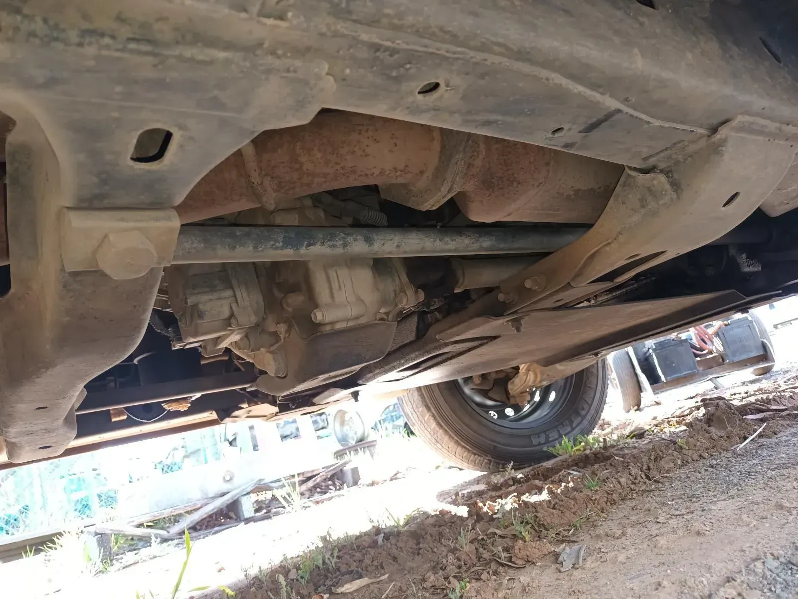 Underside of a Vehicle Showing a Rusty Exhaust System and Transfer Case — South West 4WD Wreckers In Brisbane, QLD