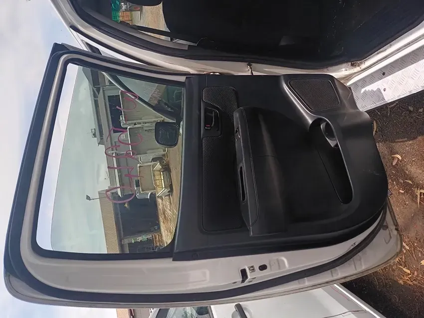 The Back Door of a White Car is Open — South West 4WD Wreckers In Brisbane, QLD