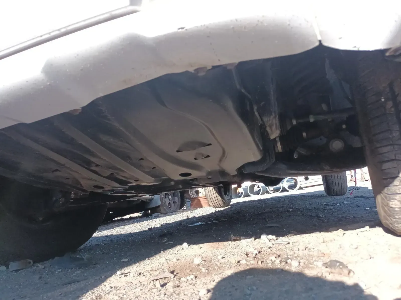 Underside of a White Vehicle, Showing the Undercarriage and a Tyre — South West 4WD Wreckers In Brisbane, QLD
