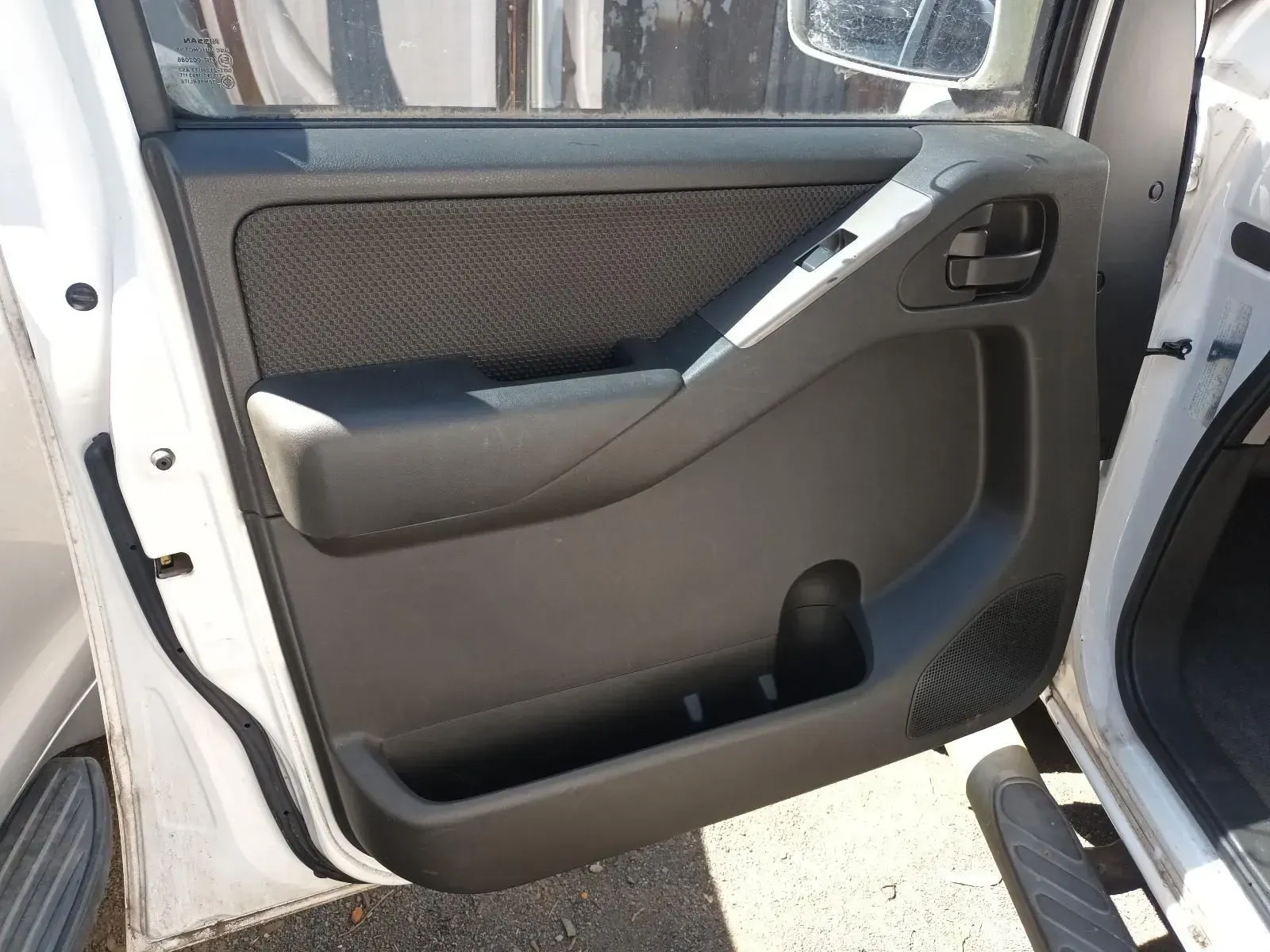 White Car Door's Interior, Black Panel With Speaker, Handle, and Storage — South West 4WD Wreckers In Brisbane, QLD