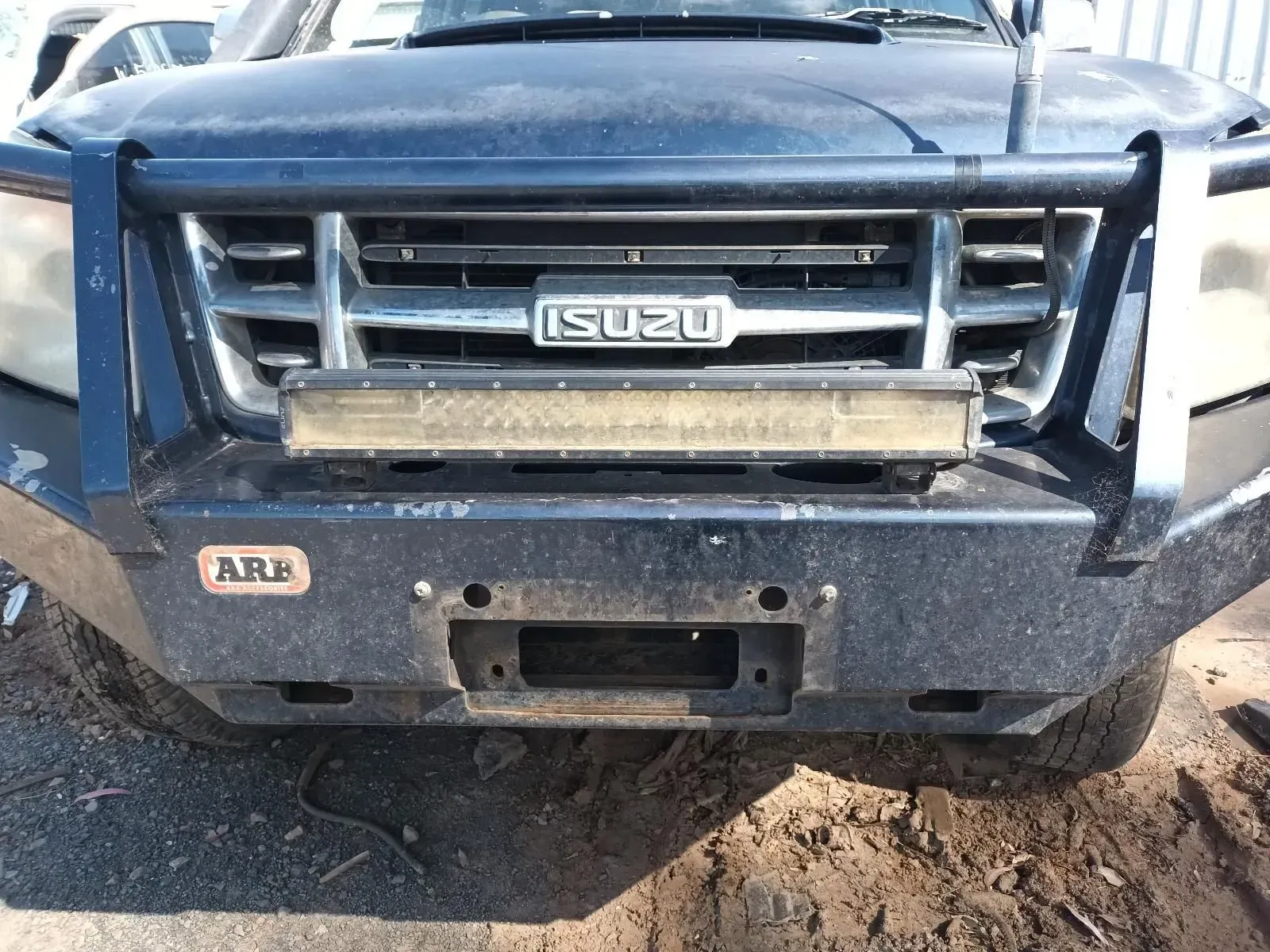Dark Blue Isuzu Suv Front End With Arb Bumper, Light Bar, and Silver Grill — South West 4WD Wreckers In Brisbane, QLD