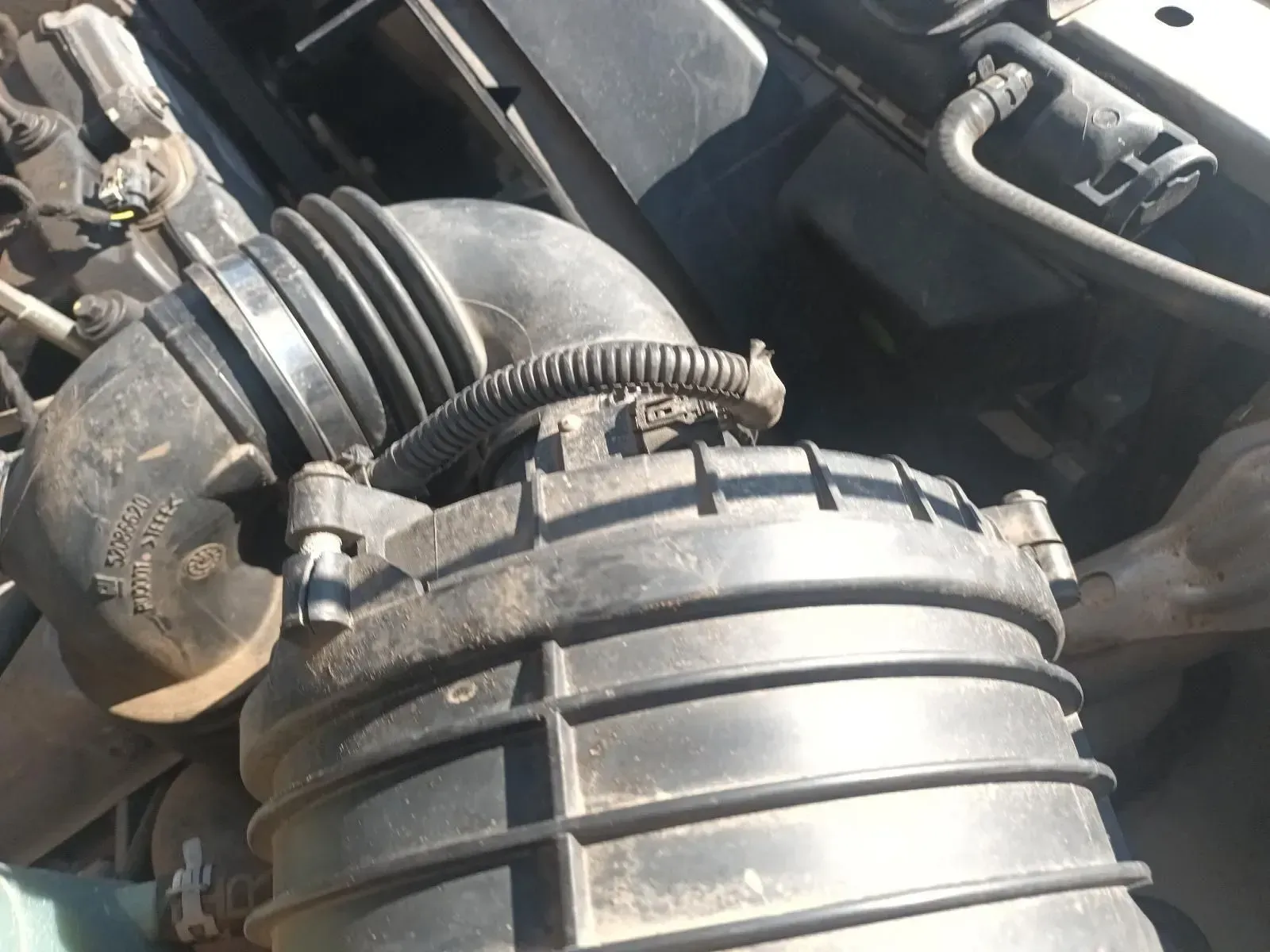Black Air Filter Box and Intake Tube in an Engine Compartment — South West 4WD Wreckers In Brisbane, QLD