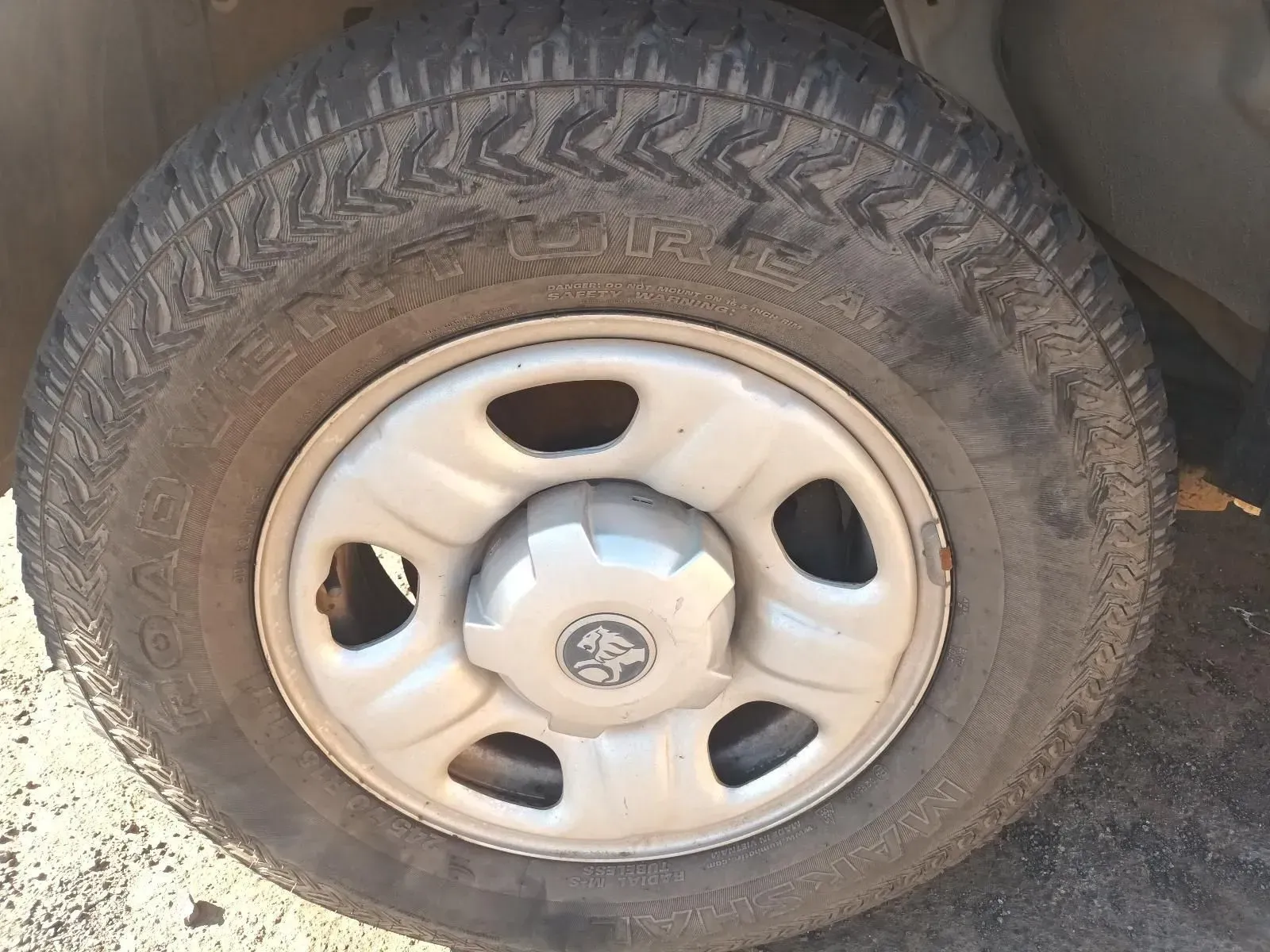 A Close-up of a Car Tyre and Rim, With a Gray Hubcap — South West 4WD Wreckers In Brisbane, QLD