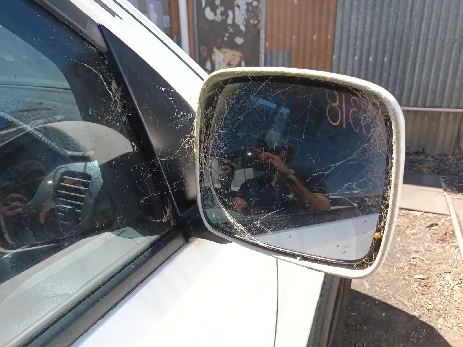 Damaged Side View Mirror on a White Car — South West 4WD Wreckers In Brisbane, QLD