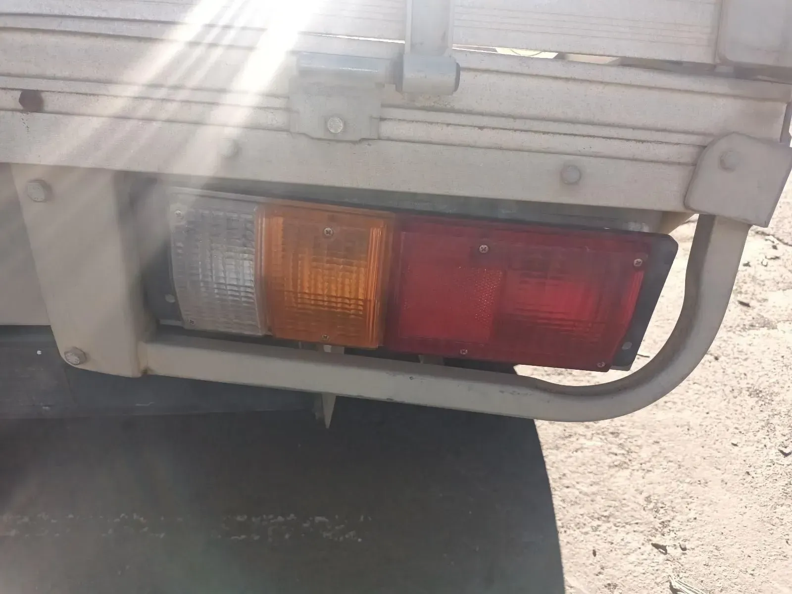 Tail Light of a White Truck, Showing a White, Orange, and Red Lens — South West 4WD Wreckers In Brisbane, QLD
