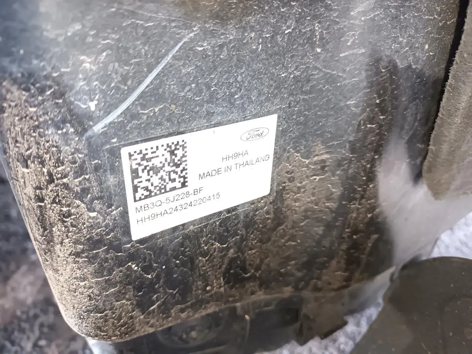 Ford Part Sticker, Black and White, on a Dusty Surface — South West 4WD Wreckers In Brisbane, QLD