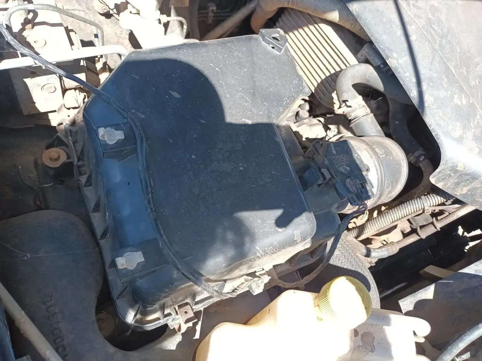 Car Engine Compartment Showing Air Filter Box, Hoses, and Coolant Reservoir — South West 4WD Wreckers In Brisbane, QLD