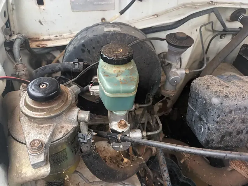 A Close Up of a Car Engine With a Brake Fluid Bottle — South West 4WD Wreckers In Brisbane, QLD
