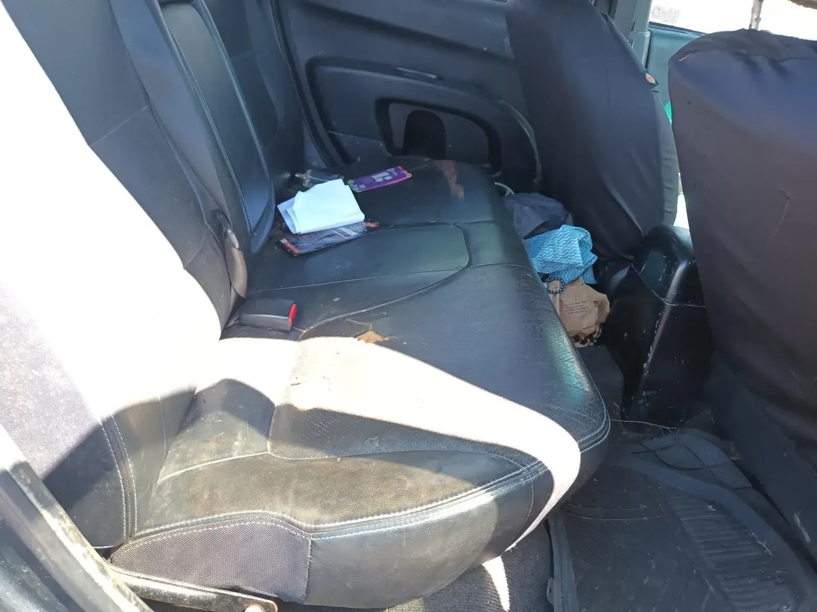 Black Car Backseat With Items Scattered on the Seat — South West 4WD Wreckers In Brisbane, QLD