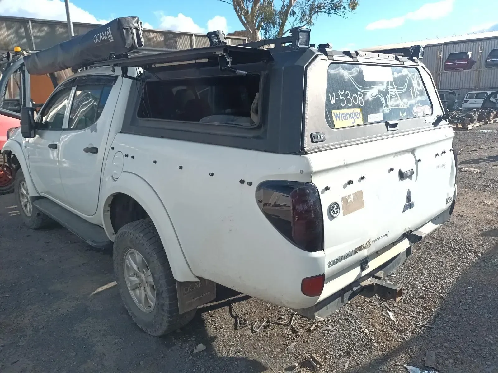 White Pickup Truck With a Black Canopy, Outdoors — South West 4WD Wreckers In Brisbane, QLD