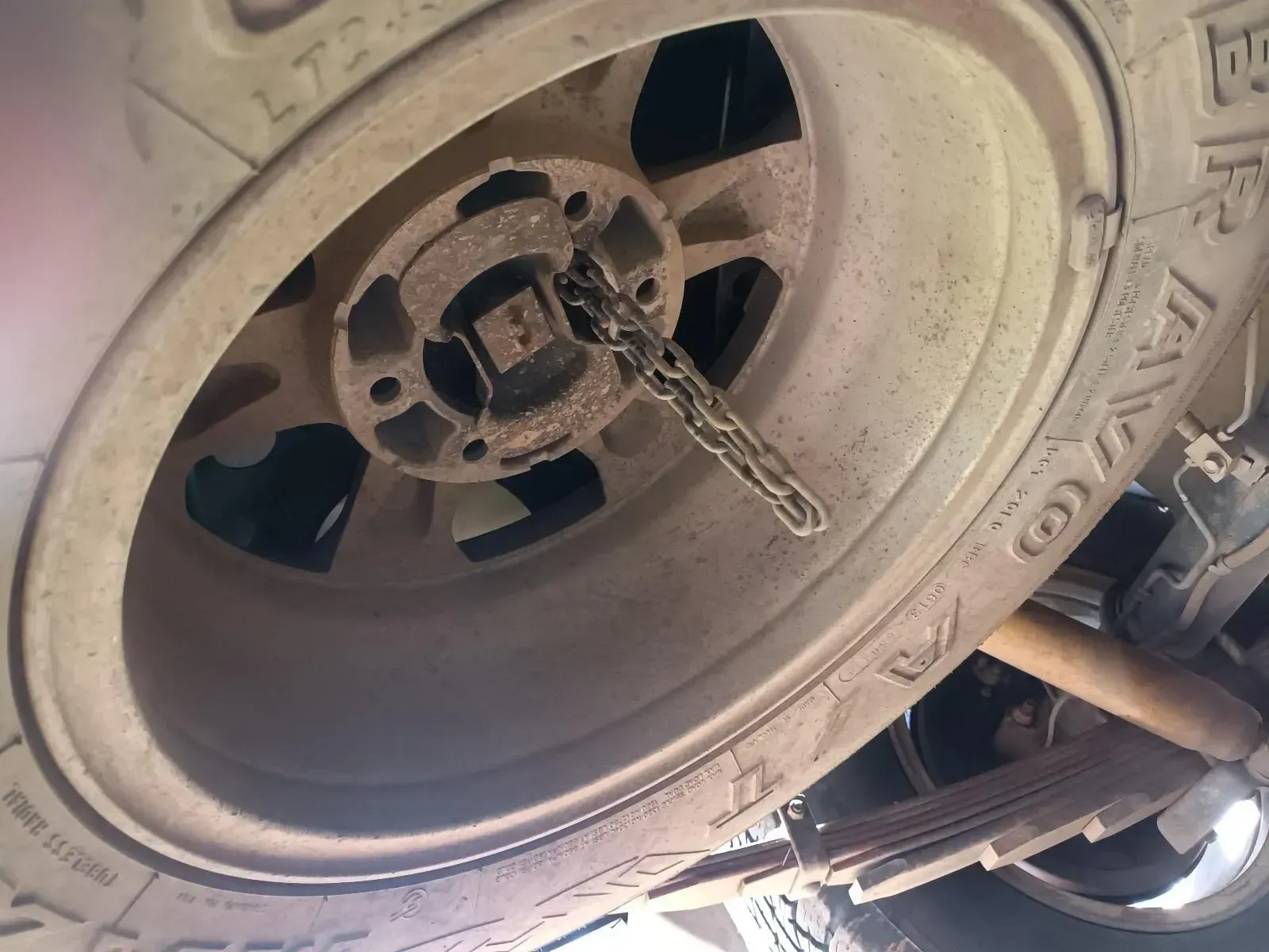 Underside View of a Vehicle Wheel; Chain Wrapped Around the Hub — South West 4WD Wreckers In Brisbane, QLD