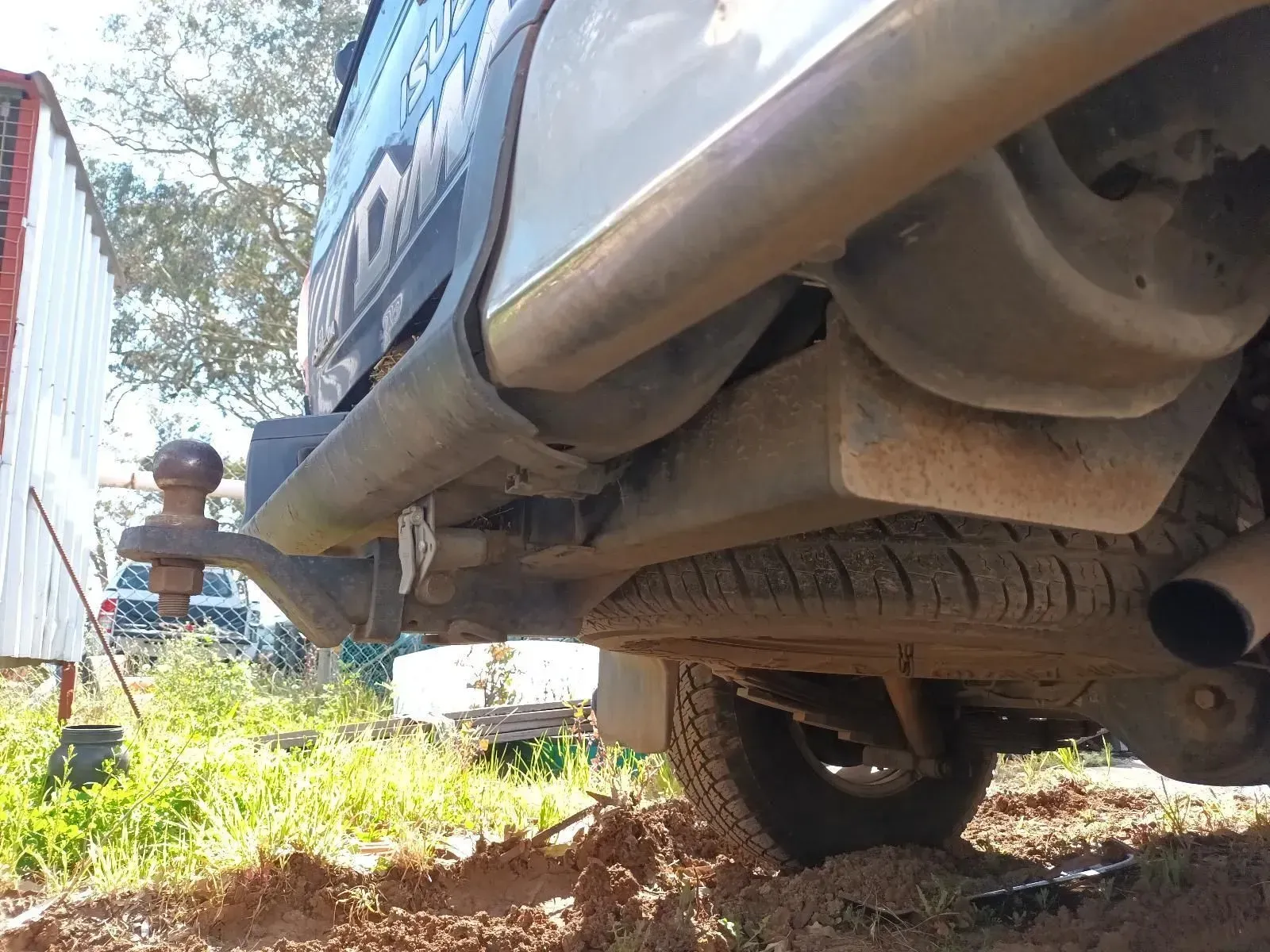 Rear Underside of a Truck With a Tow Hitch, Spare Tyre, and Exhaust Pipe — South West 4WD Wreckers In Brisbane, QLD