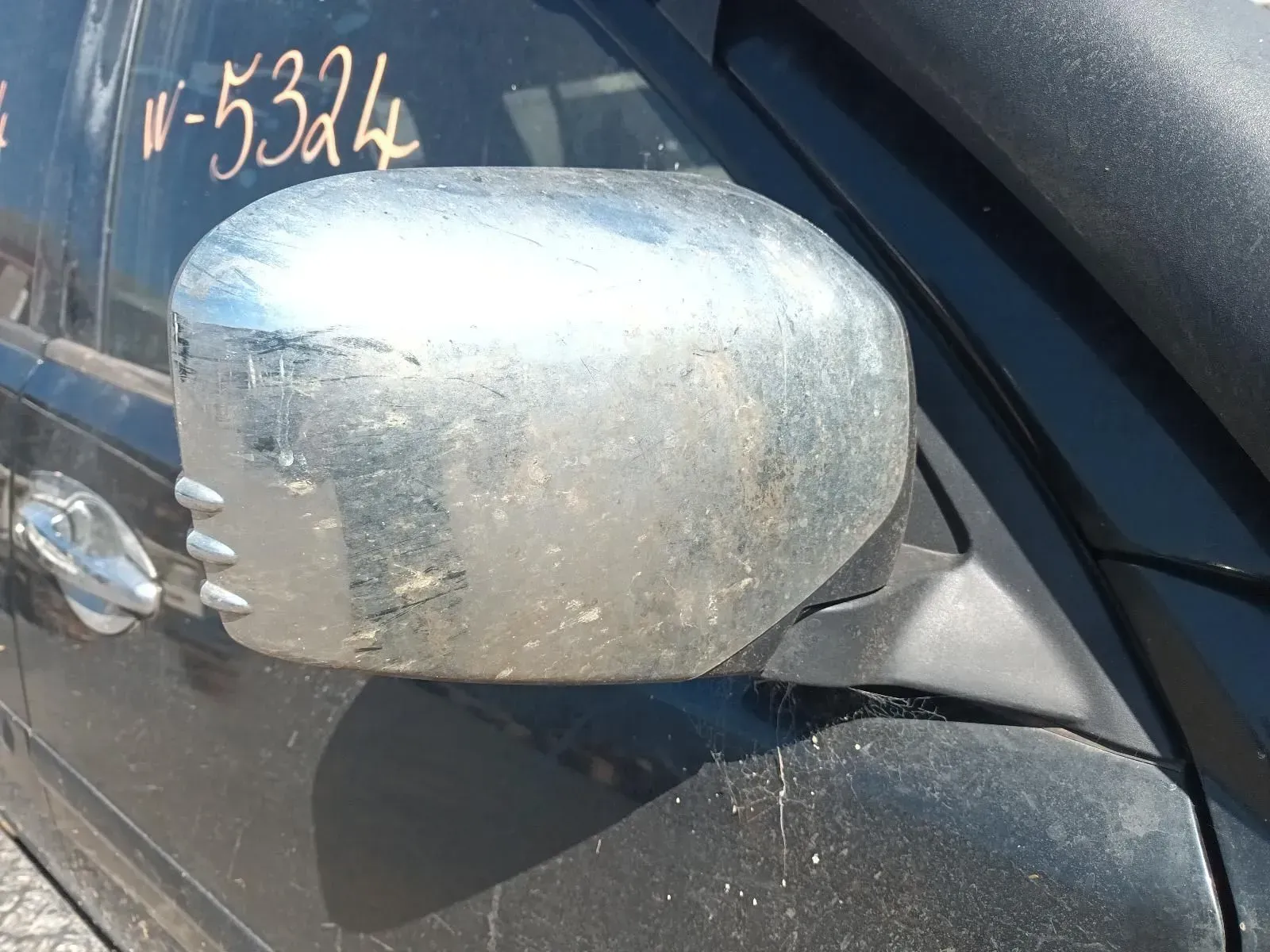 Dirty, Silver Side Mirror on a Black Car, Exterior View — South West 4WD Wreckers In Brisbane, QLD