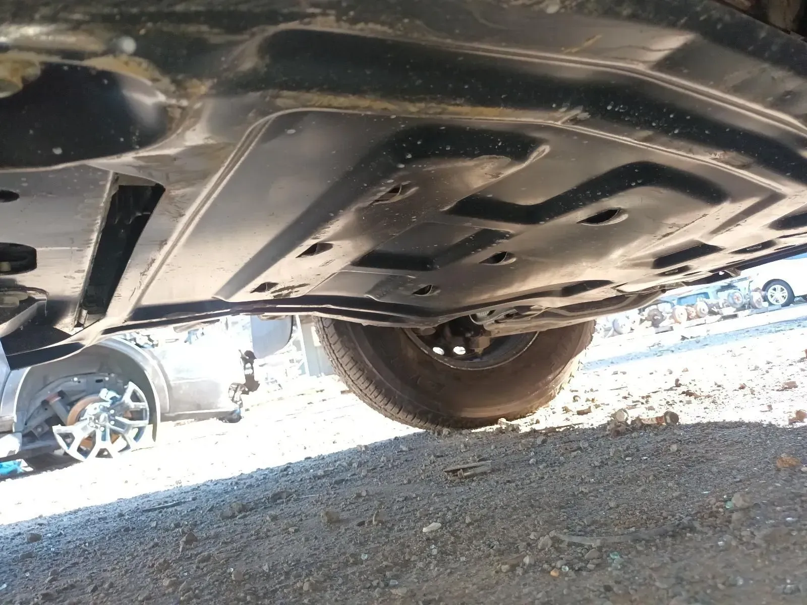Underside of a Black Car, Showing a Plastic Undercarriage Panel — South West 4WD Wreckers In Brisbane, QLD