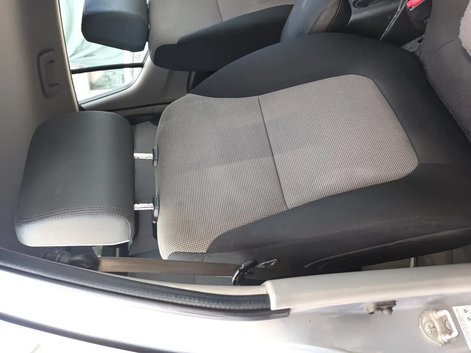 Gray and Black Car Seat With Headrest and Armrest, Set Inside a Silver Car — South West 4WD Wreckers In Brisbane, QLD