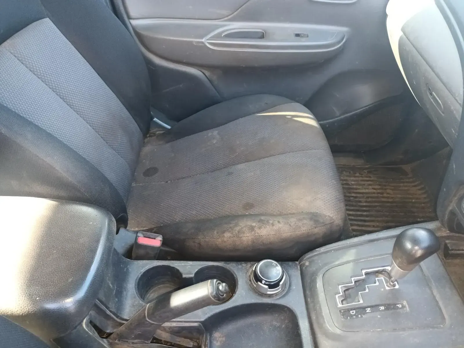 Dirty Gray Fabric Car Seat, Gear Shift, and Center Console — South West 4WD Wreckers In Brisbane, QLD